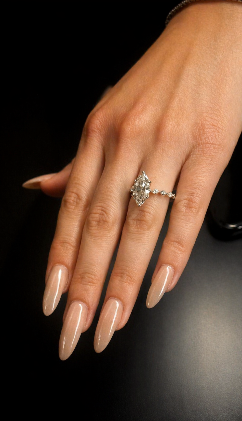 Marquise cut engagement ring with round and marquise diamond band