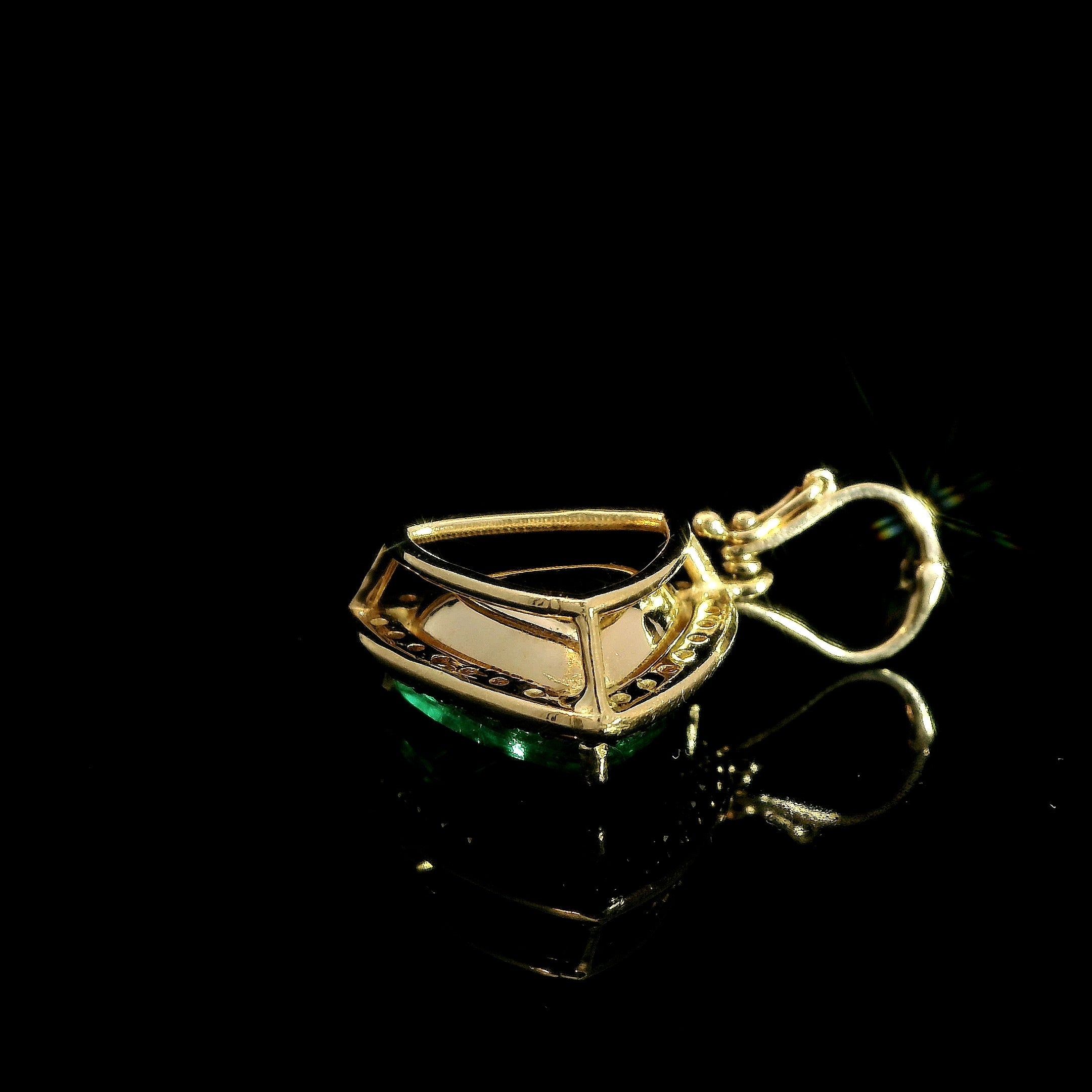 Trillion cut Colombian Emerald with diamond halo pendant