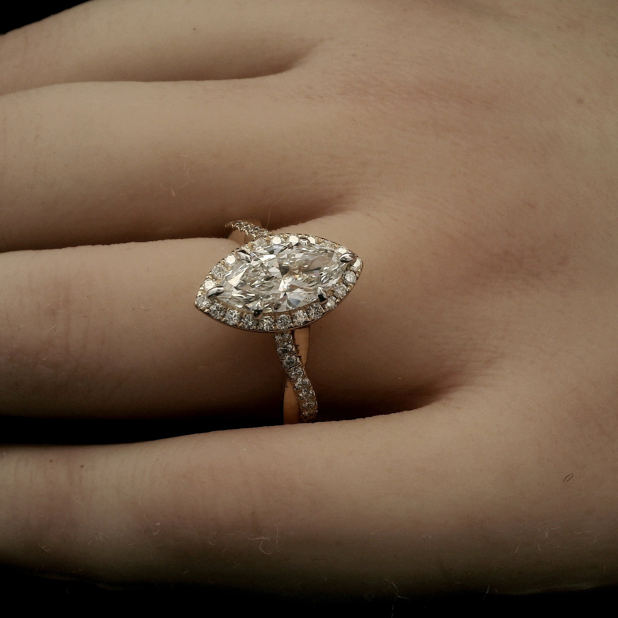Marquise Diamond Halo Engagement Ring with Intertwining Gold Band