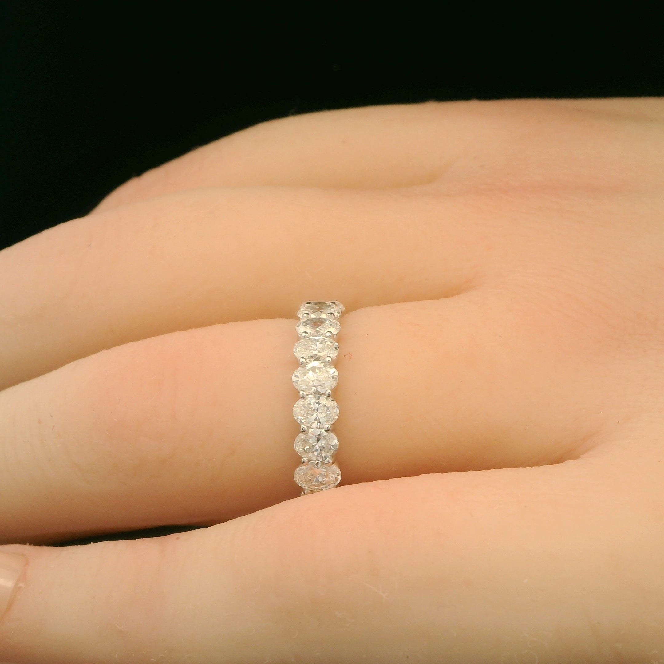 Oval diamonds wedding band