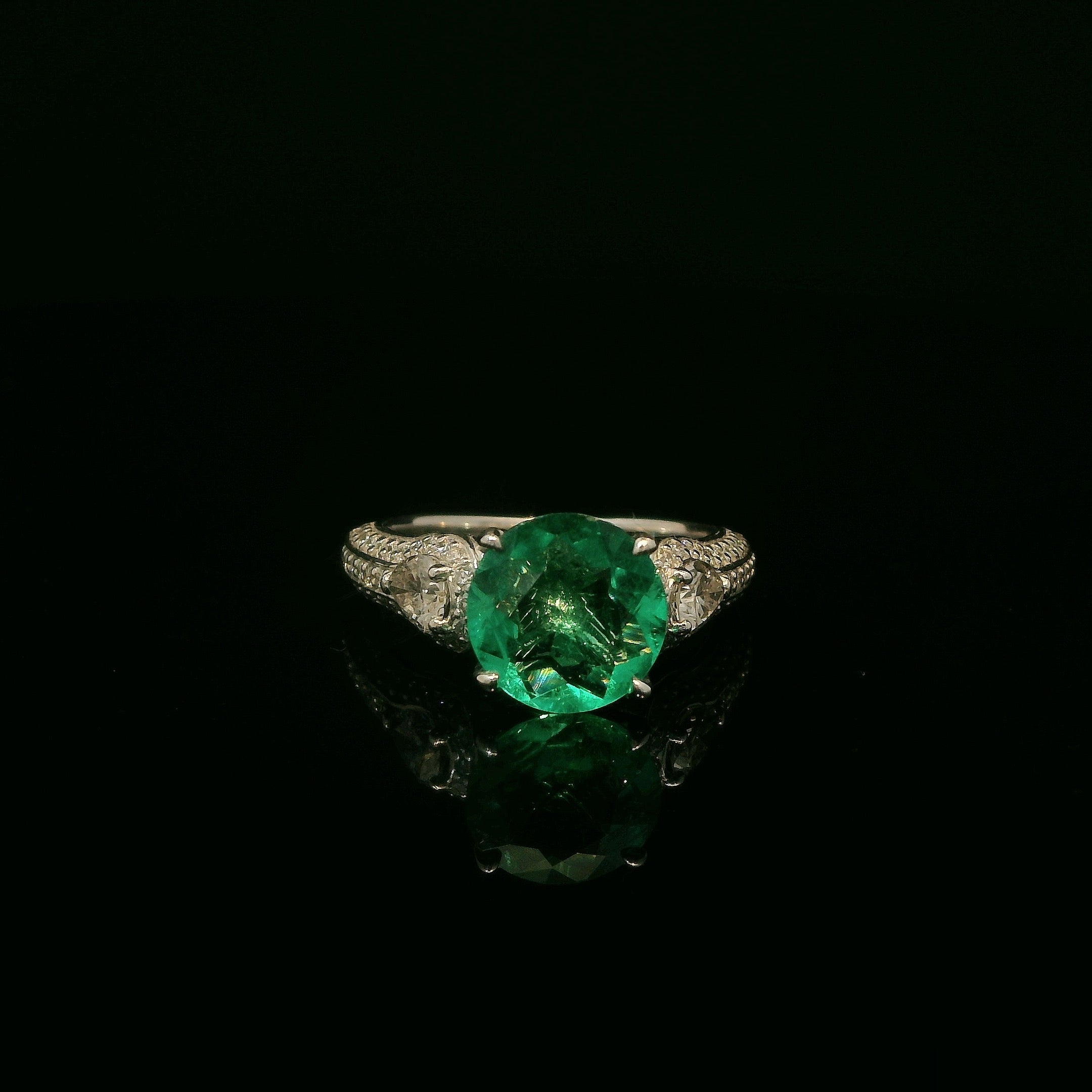 Unique Colombian round emerald ring