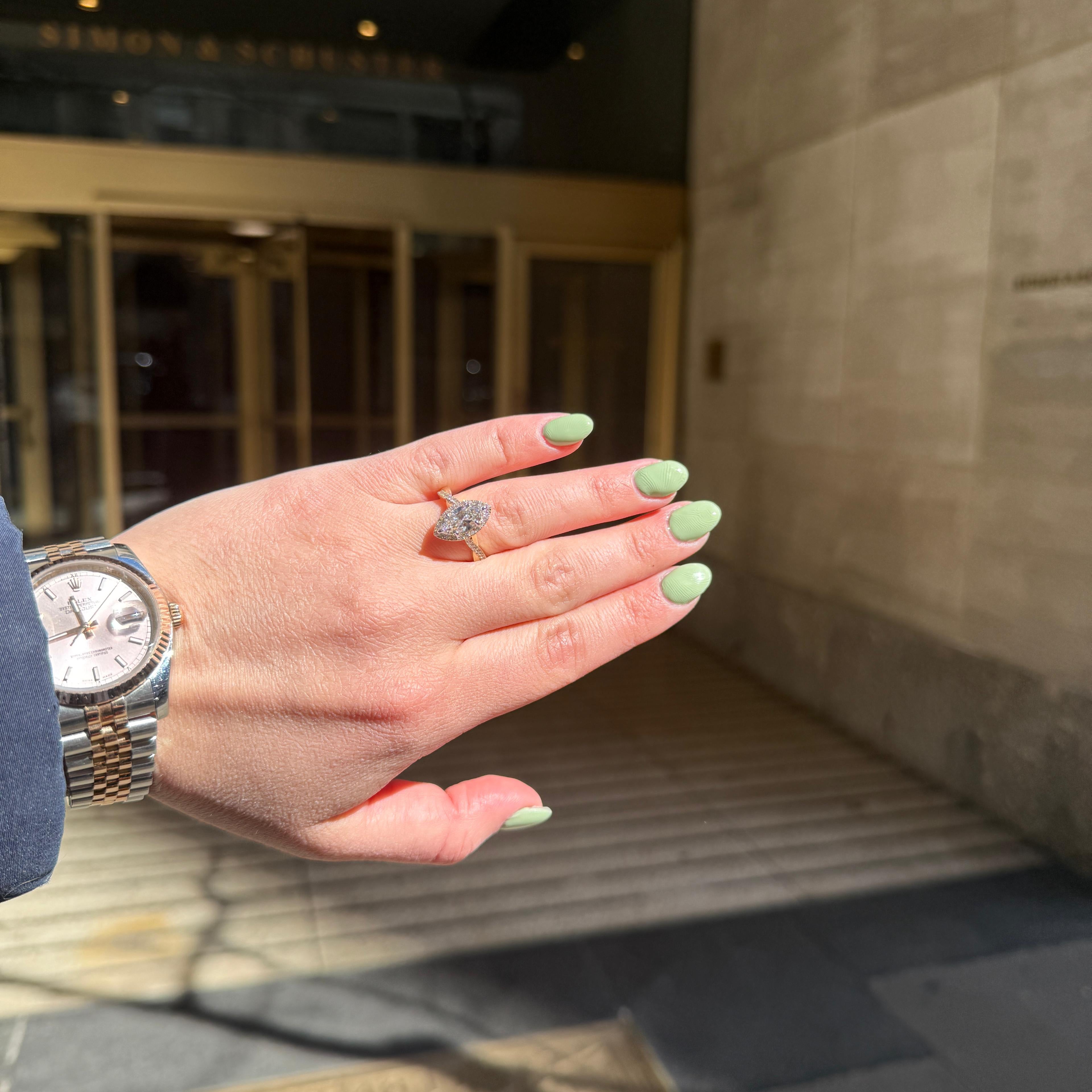 Marquise Diamond Halo Engagement Ring with Intertwining Gold Band