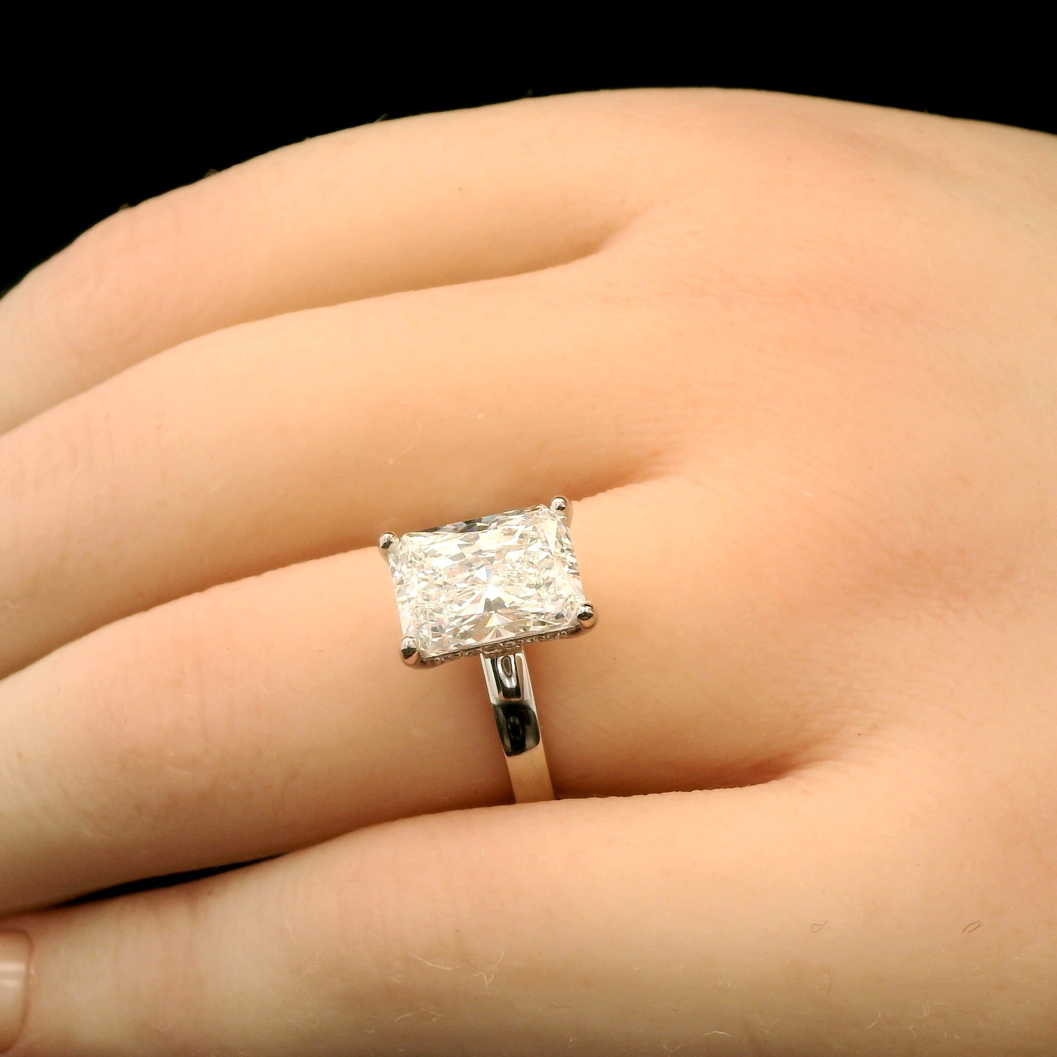 3 carat Radiant solitaire engagement ring with hidden halo