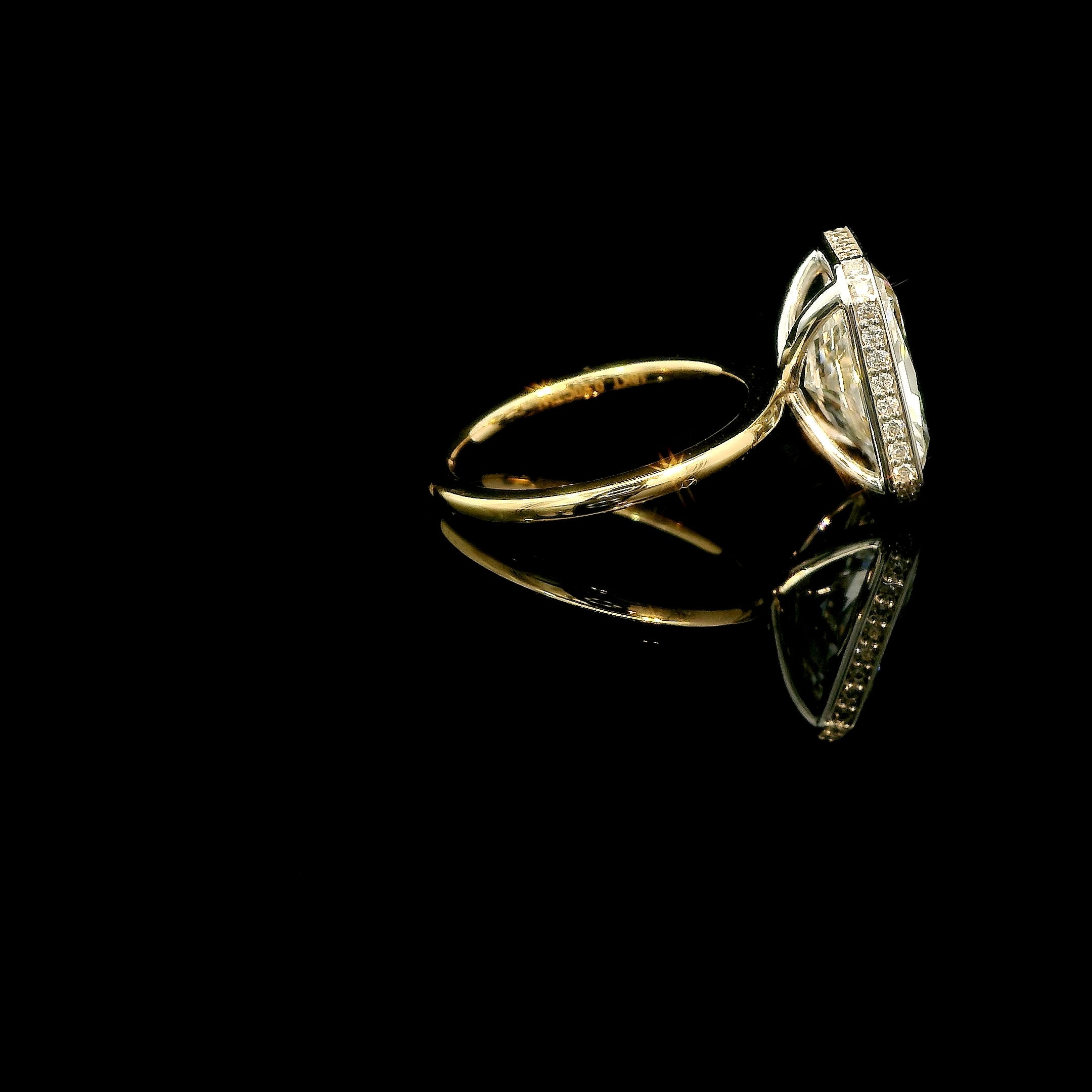 Radiant Light, 5ct Radiant Cut bezeled Engagement Ring