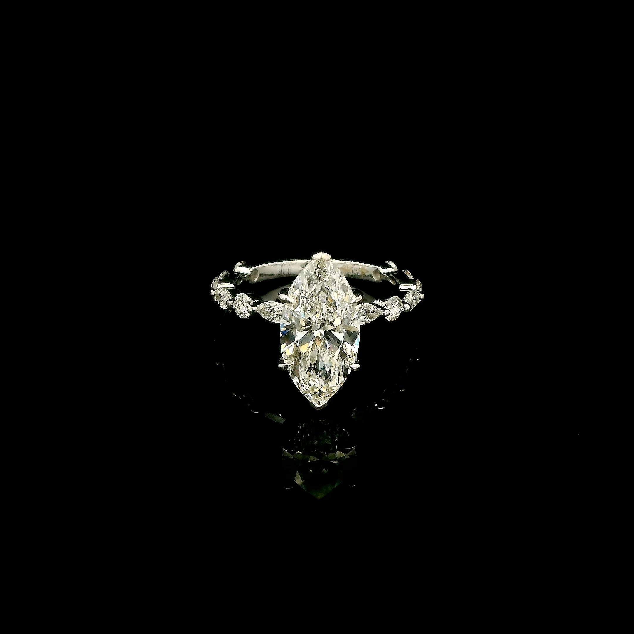 Marquise cut engagement ring with round and marquise diamond band